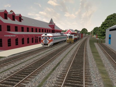 Westbound Extra from Wolfville enters yard as 9059, eastbound passenger waits for extra to clear switch before proceding east to Halifax.