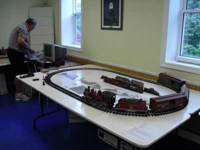 My working G scale DAR trains as well as some HO DAR and photo display, including some DARDPI promo material.