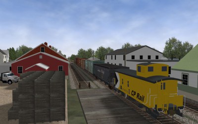 Extra 8131 passes by all the apple warehouses in Berwick.