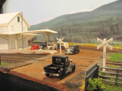 The level crossing at Kentville with a foam-core mock-up of the Kentville Station awaiting the completion of the scratchbuilt model.